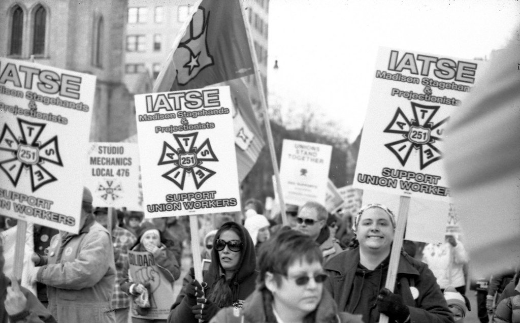 women holding IATSE picket signs